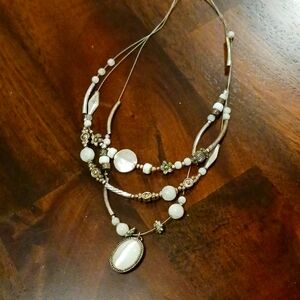 Ladies silver tone necklace with white and silver beads